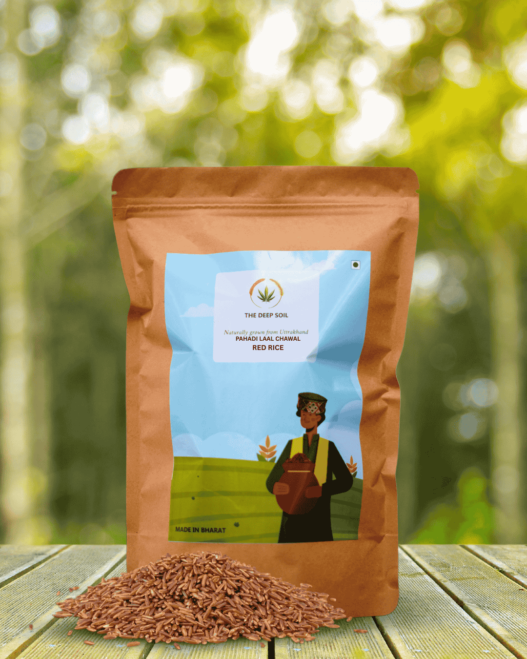 The Deep Soil Red Rice Pahadi Laal Chawal Uttarakhand Origin Lifestyle Background The Deep Soil Red Rice Pahadi Laal Chawal package with a pile of raw grains on a wooden table and sunlit forest background